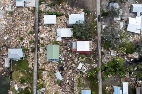 Chandan Khanna/AFP An aerial view of damaged houses are seen after Hurricane Helene made landfall in Horseshoe Beach, Florida, on September 28, 2024.